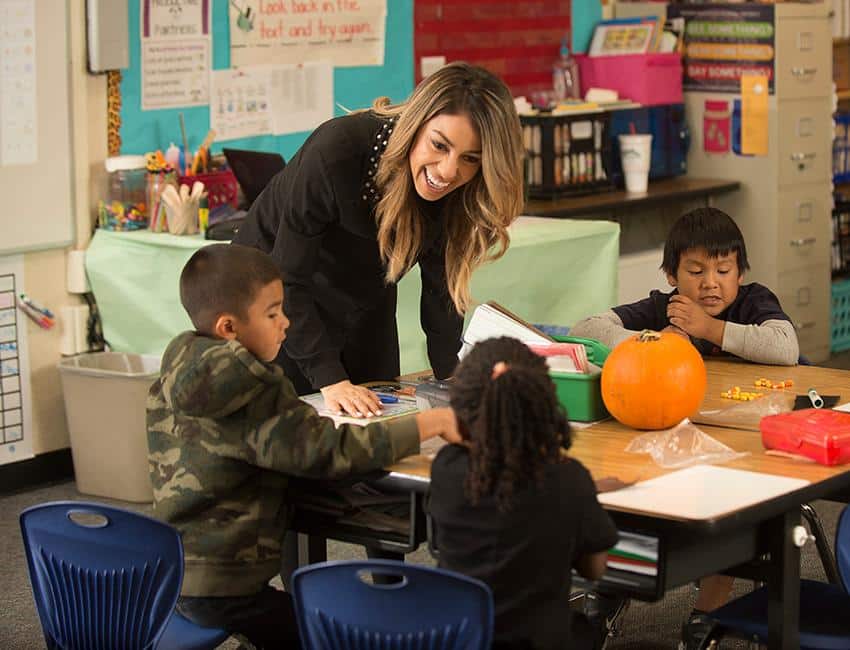 Special education teacher working with students in an inclusive classroom