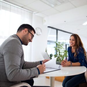 Recruiter reviewing a candidate’s documents during a temporary staffing interview